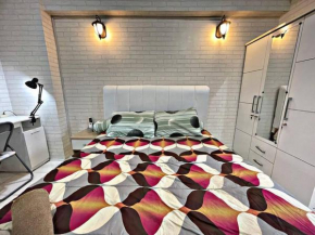 Bright cozy studio 1BR Cityview, SmartTV,FAST Wifi at Greenbay Pluit